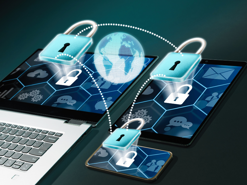 Digital padlock icons emerging from various connected devices and surrounding a glowing globe, symbolizing the importance of maintaining strong cyber security measures in today’s interconnected digital world.