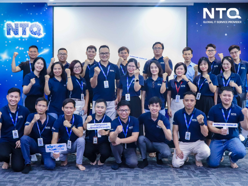 Group of NTQ staff members standing together, representing teamwork, unity, and the company’s collaborative culture.